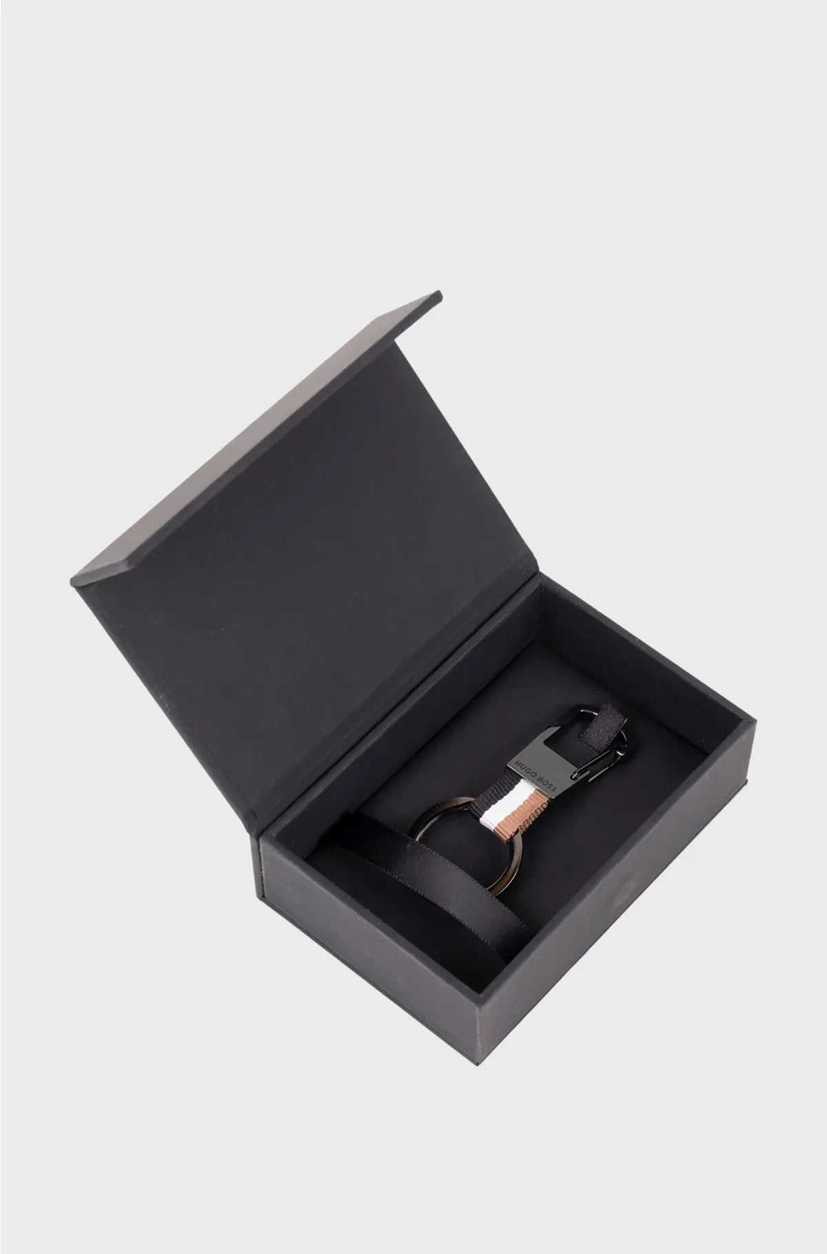 SIGNATURE-STRIPE KEY RING WITH DARK-CHROME ACCENTS