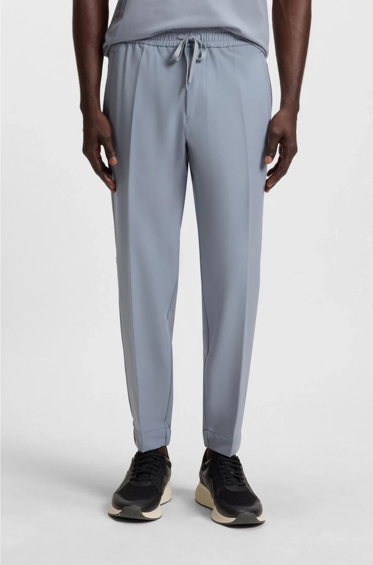 TAPERED-FIT TROUSERS IN WATER-REPELLENT STRETCH FABRIC