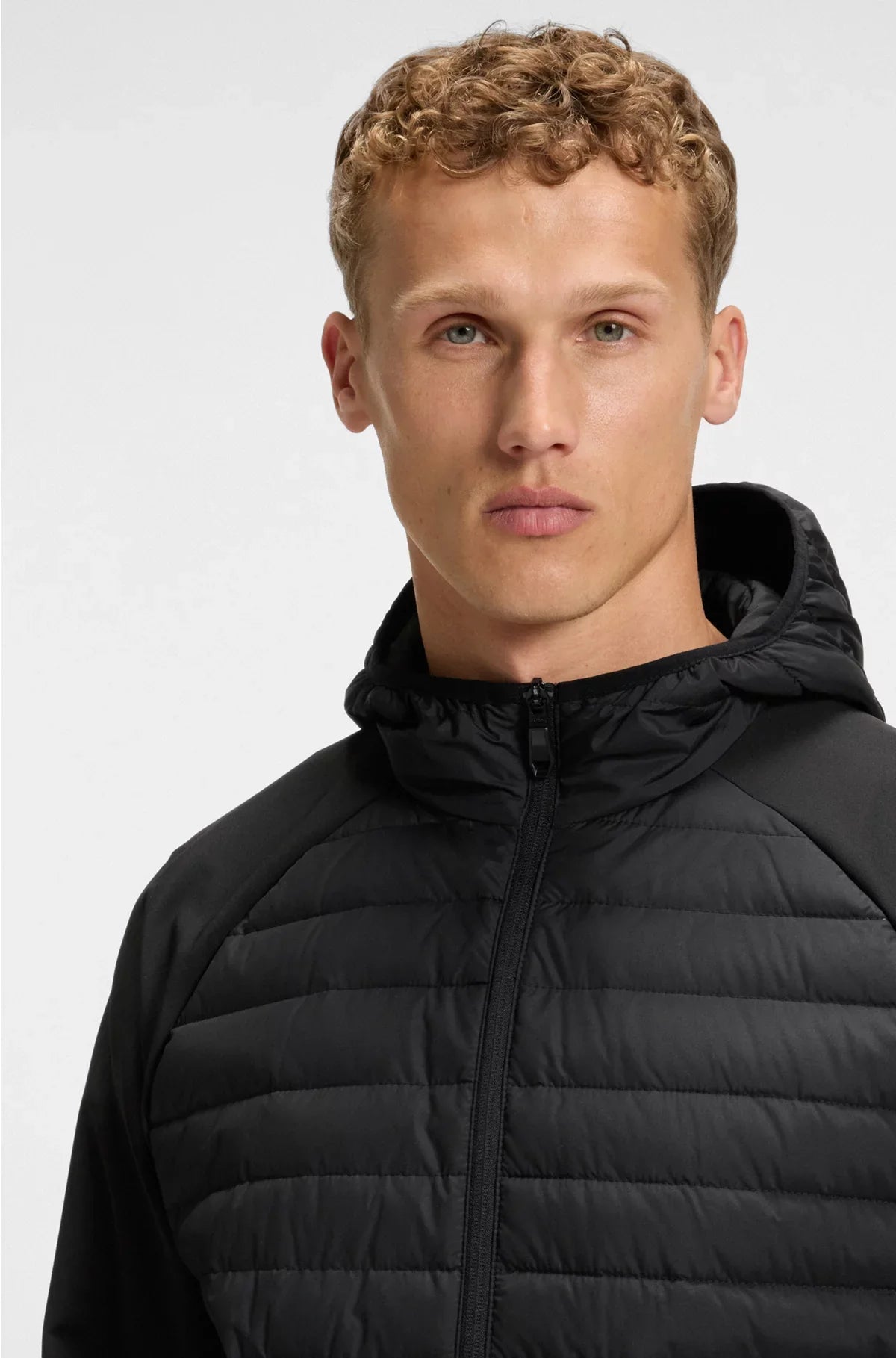 WATER-REPELLENT JACKET WITH ZIPPED SLEEVE POCKET
