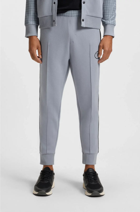 PANTALONI DELLA TUTA IN PIQUÉ ELASTICIZZATO CON STAMPA A QUADRI