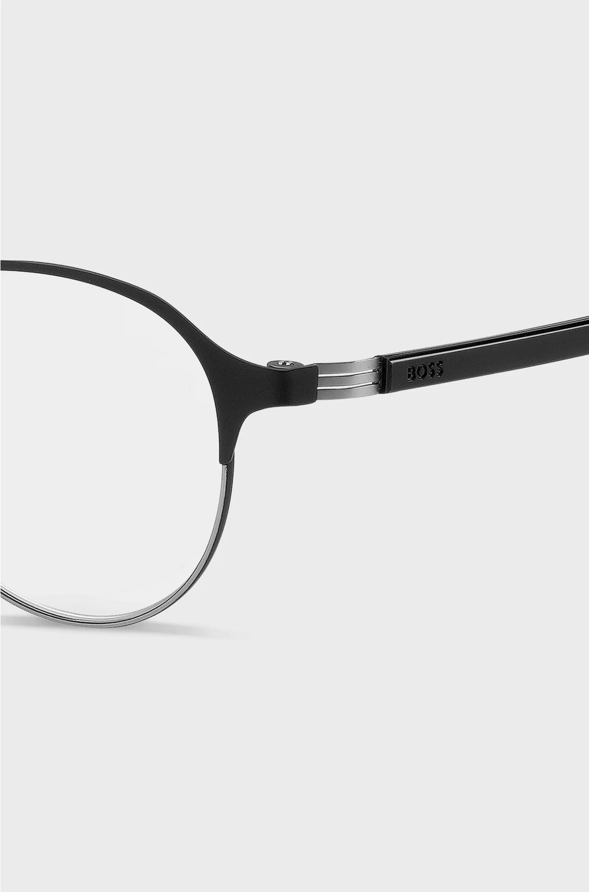 ROUND OPTICAL FRAMES IN BLACK STEEL WITH STRIPED HINGE