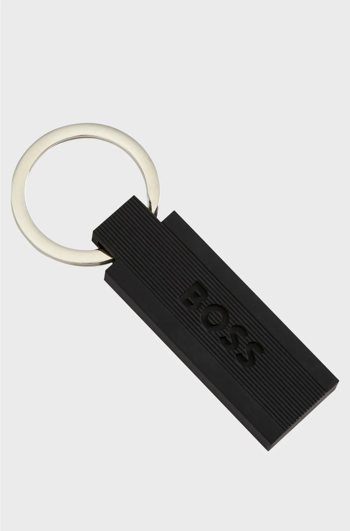 LOGO KEY RING IN BLACK SILICONE AND BRASS