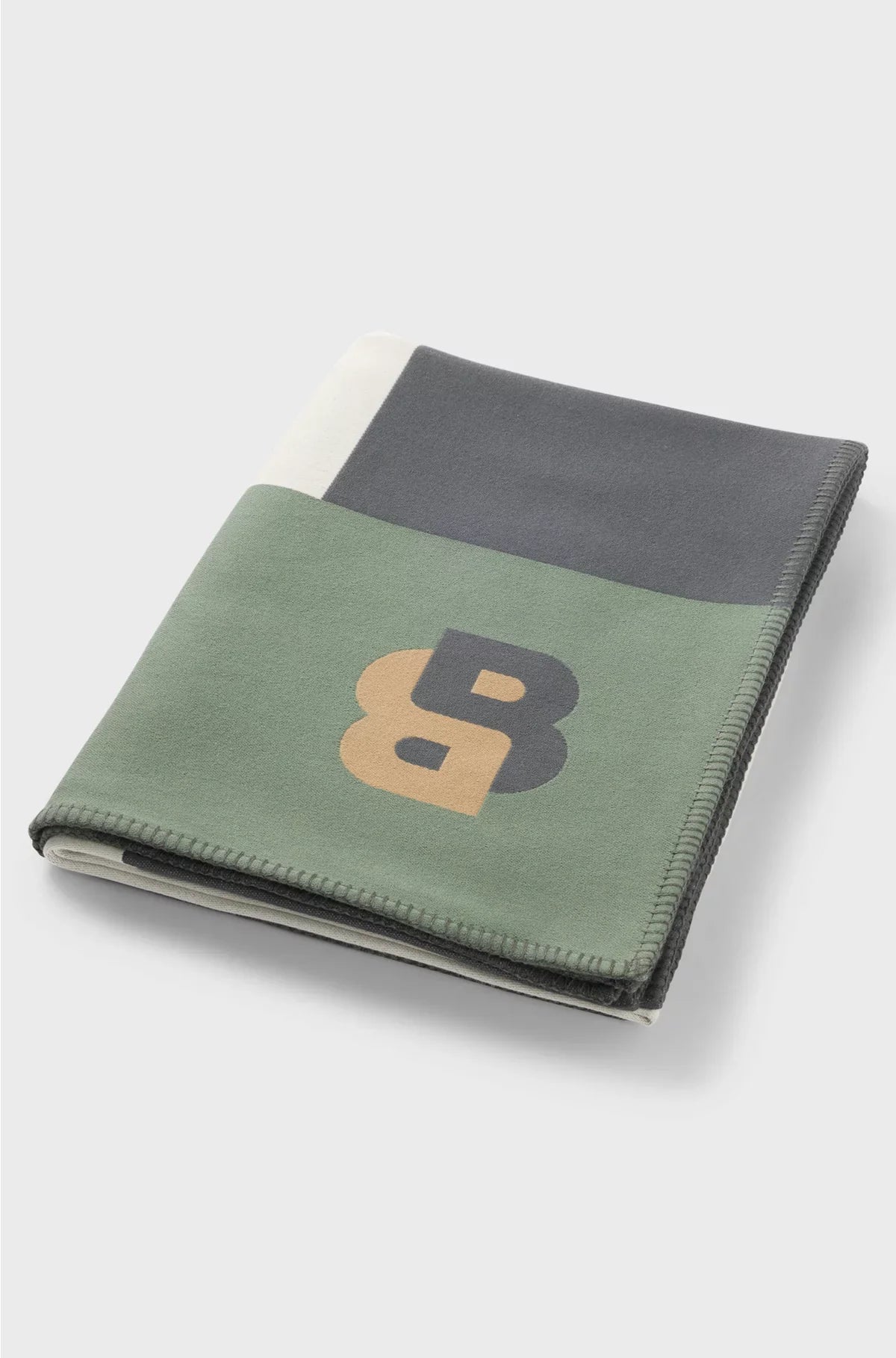 JACQUARD THROW WITH WHIPSTITCHING